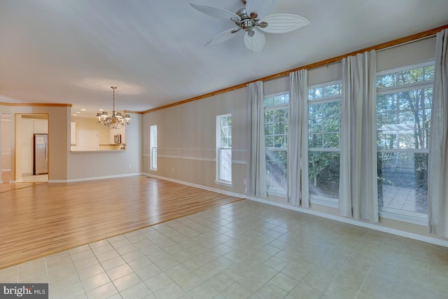 unfurnished living room featuring ceiling fan with notable chandelier, ornamental molding, and light hardwood / wood-style flooring