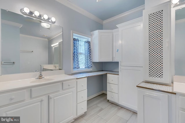 bathroom featuring crown molding and vanity