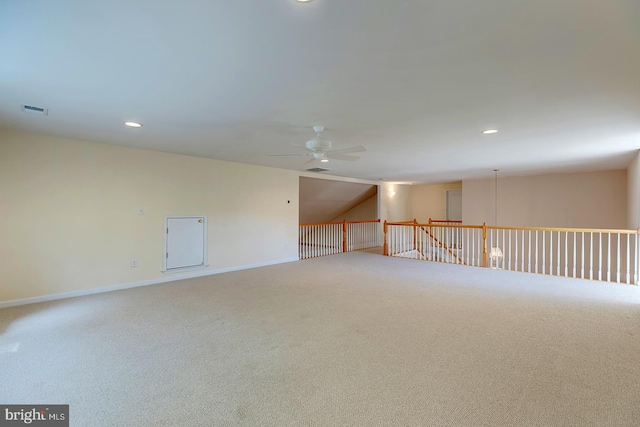 spare room featuring ceiling fan and carpet