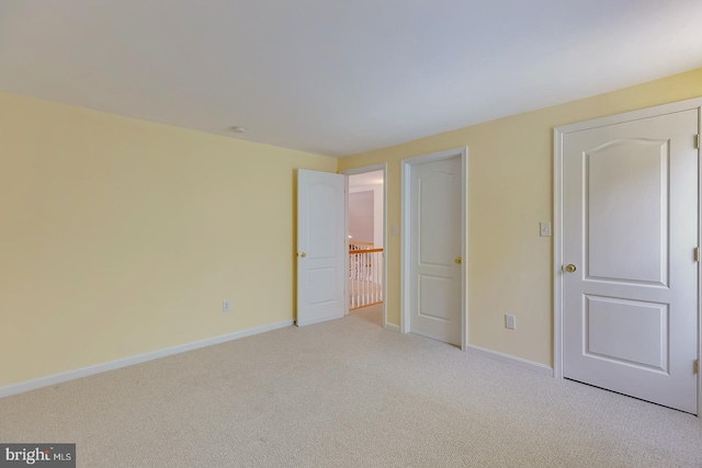 unfurnished bedroom with light carpet