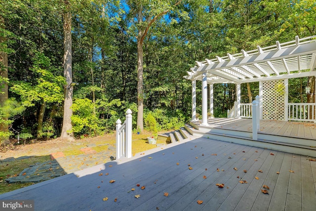 wooden deck featuring a pergola