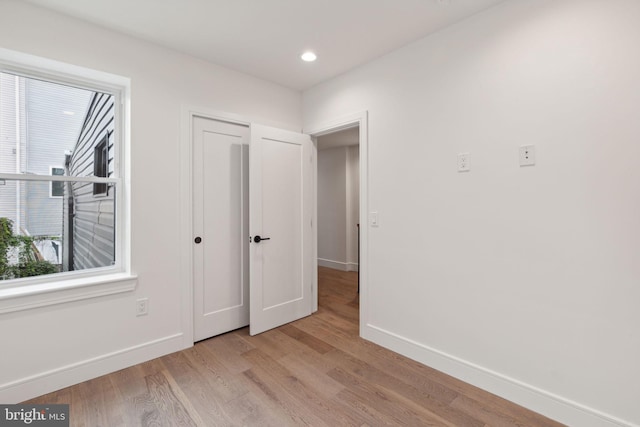 unfurnished bedroom with light hardwood / wood-style floors