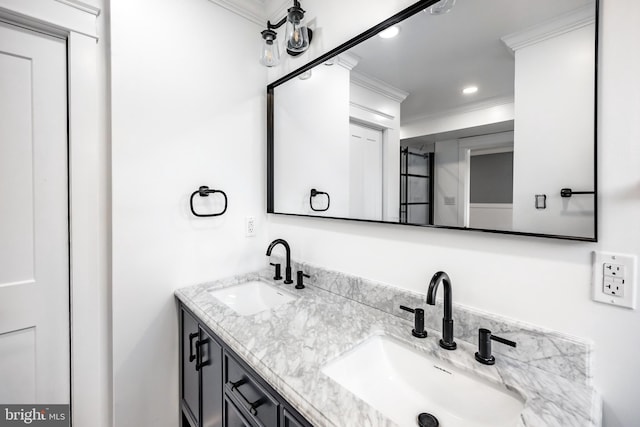 bathroom with vanity and ornamental molding