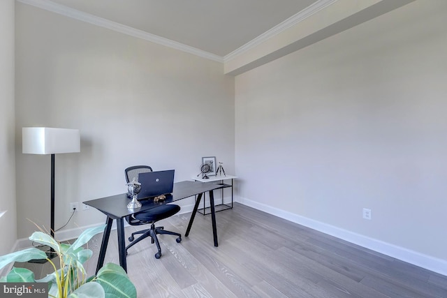 office area featuring wood-type flooring and ornamental molding