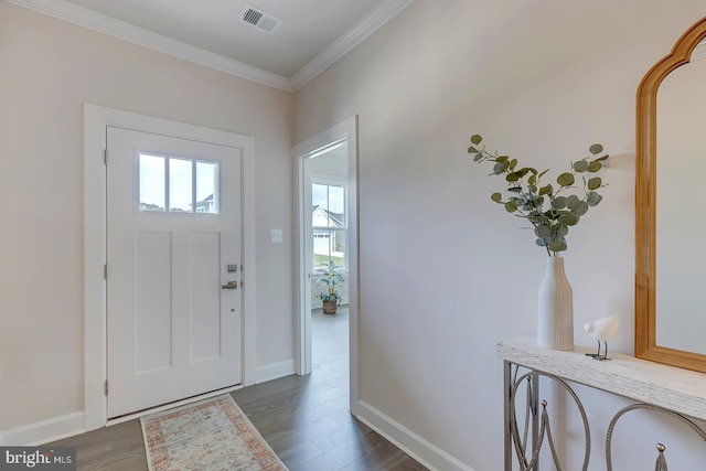 foyer featuring ornamental molding and dark hardwood / wood-style flooring