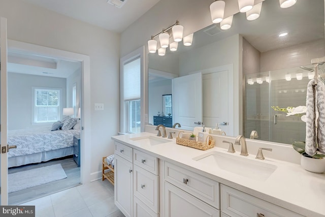 bathroom featuring walk in shower, tile patterned flooring, and vanity