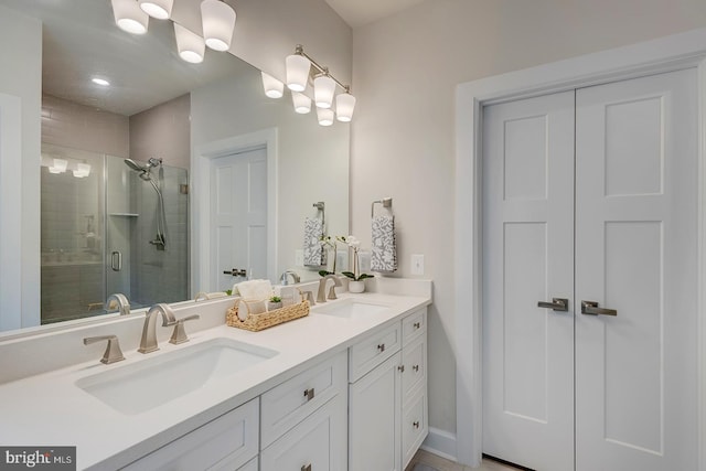 bathroom with vanity and an enclosed shower