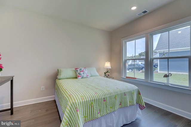 bedroom featuring dark hardwood / wood-style flooring