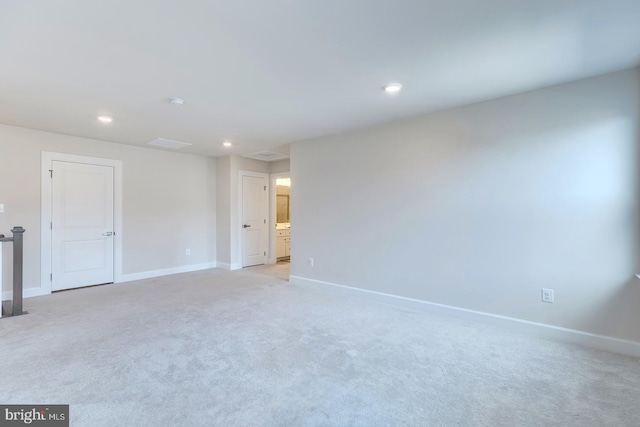 empty room featuring light carpet