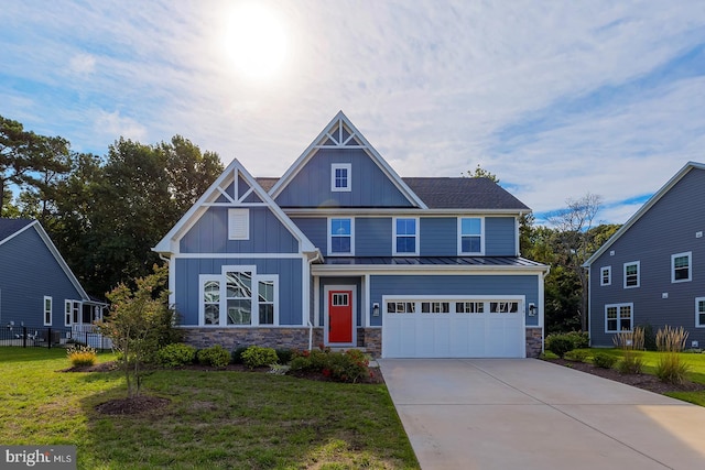 craftsman-style house featuring a garage and a front yard