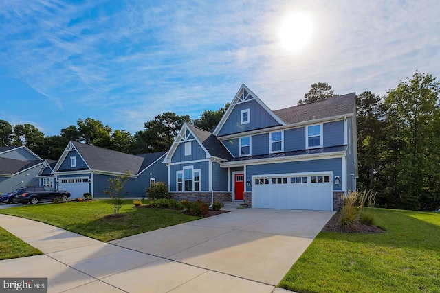 view of front facade with a garage and a front lawn