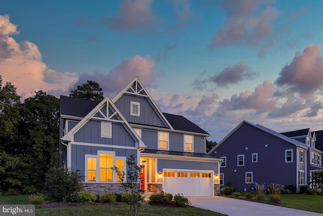 view of front facade featuring a garage and a lawn