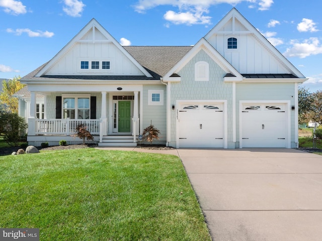 modern inspired farmhouse with a porch, a front yard, board and batten siding, and driveway