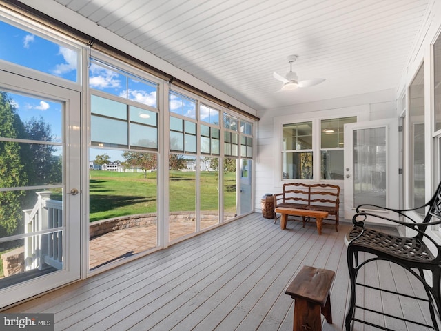 sunroom with a ceiling fan