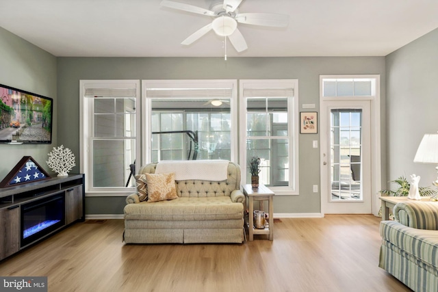 interior space featuring light wood-type flooring and ceiling fan