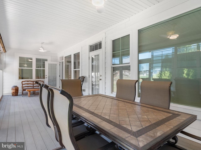 sunroom with a ceiling fan