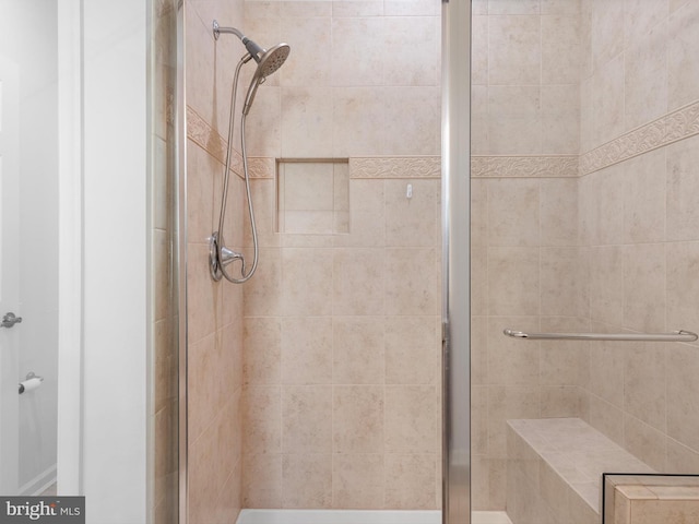 full bath featuring a shower stall