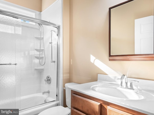 full bathroom featuring vanity, toilet, and enclosed tub / shower combo