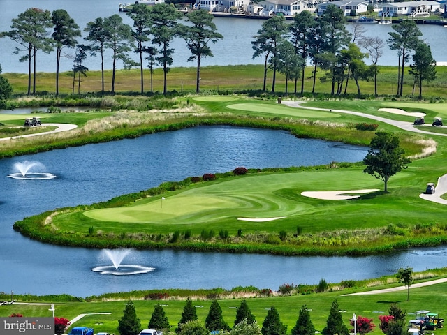 view of property's community featuring a water view and golf course view