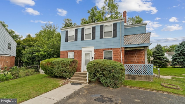 view of front of home with a front yard