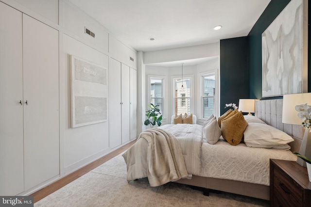 bedroom with light hardwood / wood-style floors