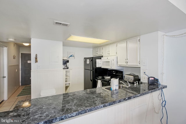 kitchen featuring white cabinetry, sink, black appliances, kitchen peninsula, and light tile patterned flooring