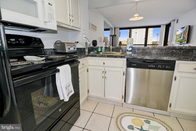 kitchen with stainless steel dishwasher, sink, black range with electric cooktop, and white cabinets