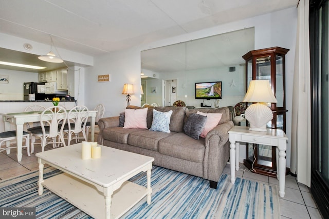 living room featuring light tile patterned floors