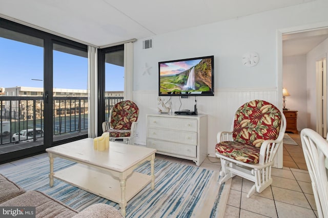 living area featuring light tile patterned flooring