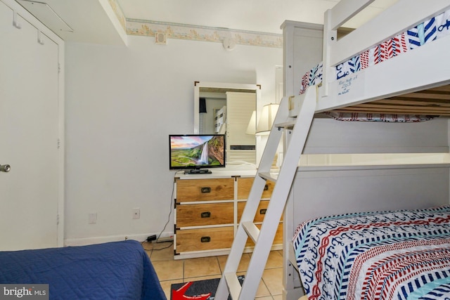 bedroom featuring light tile patterned floors