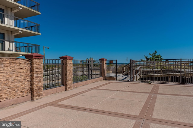 view of patio featuring a balcony