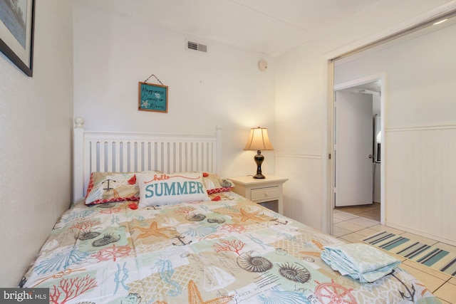 tiled bedroom with wood walls