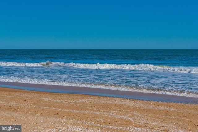 property view of water featuring a beach view