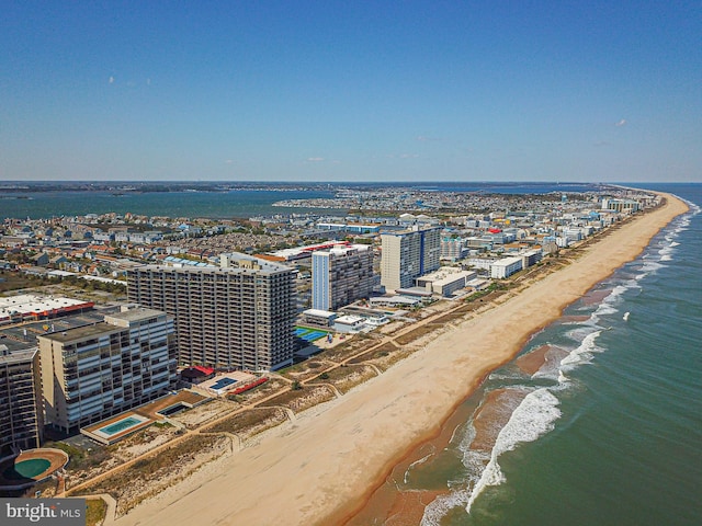 birds eye view of property featuring a water view and a view of the beach