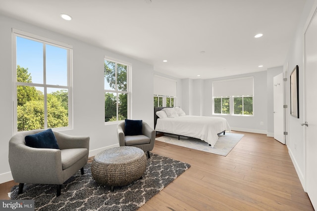 bedroom with recessed lighting, baseboards, and hardwood / wood-style flooring