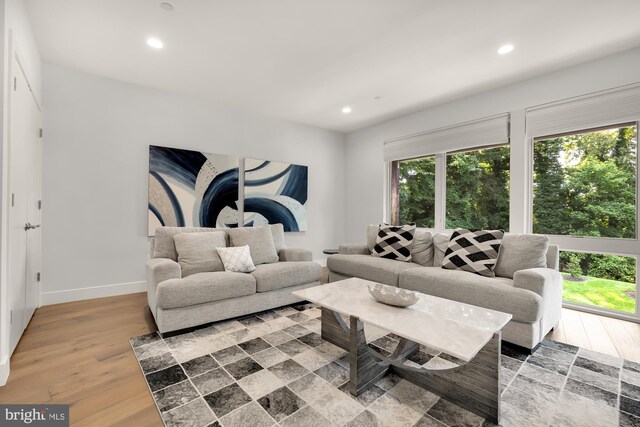 bedroom featuring ceiling fan, hardwood / wood-style flooring, and access to outside