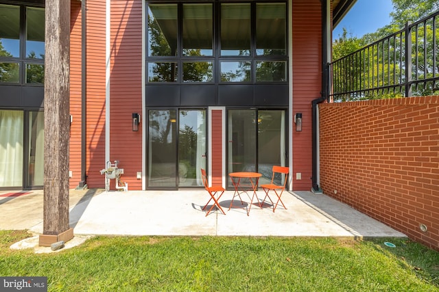 back of property with a patio