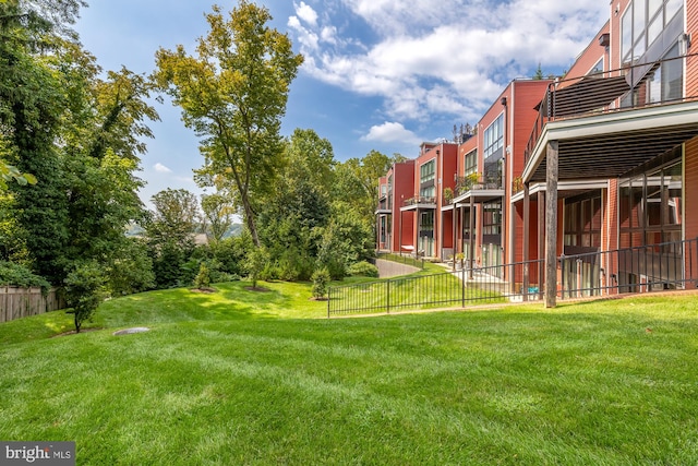 view of yard with a residential view and fence