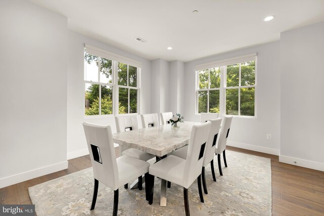 dining room featuring hardwood / wood-style flooring and plenty of natural light