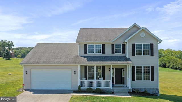 traditional-style house with a shingled roof, a front lawn, covered porch, driveway, and an attached garage