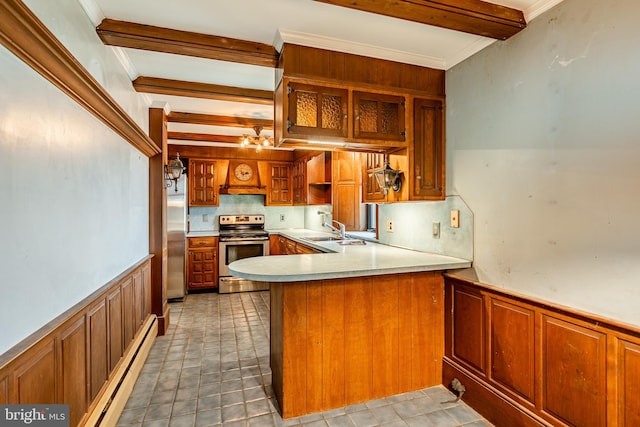 kitchen with kitchen peninsula, stainless steel appliances, beam ceiling, sink, and a baseboard heating unit