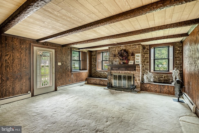 unfurnished living room featuring beamed ceiling, wood ceiling, wooden walls, baseboard heating, and carpet floors