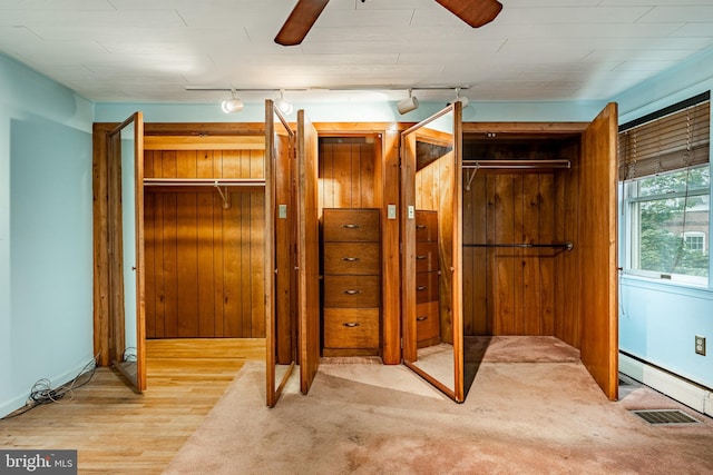 closet with a baseboard radiator