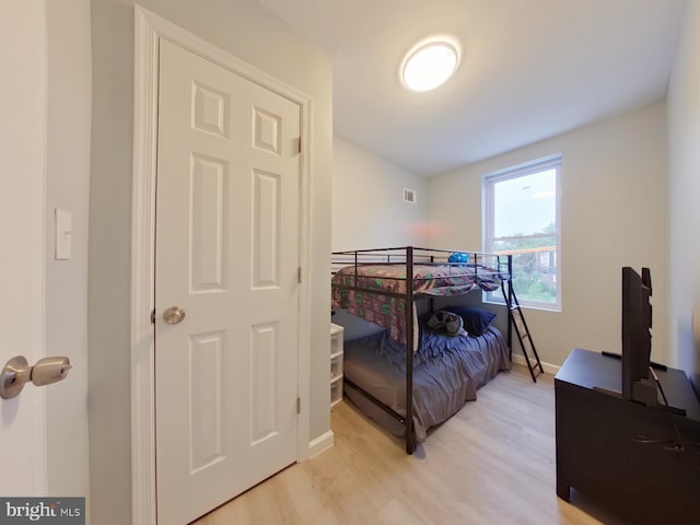 bedroom with light hardwood / wood-style floors