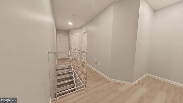 stairs with hardwood / wood-style flooring