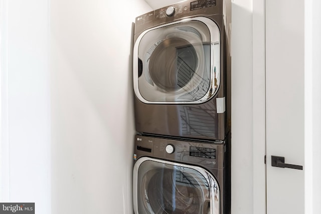 laundry room featuring stacked washing maching and dryer