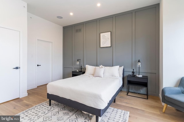 bedroom with light hardwood / wood-style flooring