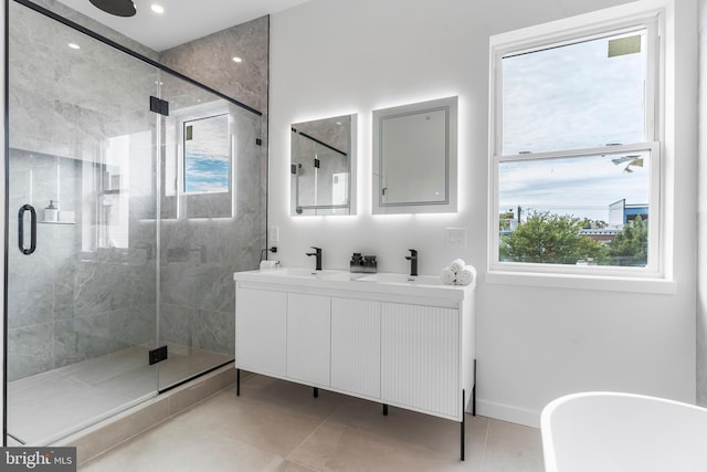 bathroom featuring vanity, plus walk in shower, and tile patterned floors