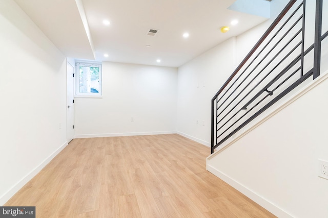 basement featuring light wood-type flooring