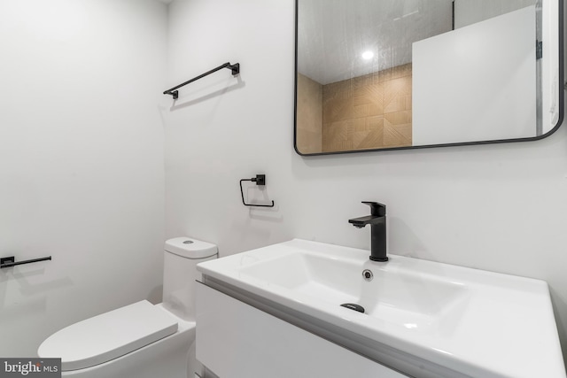 bathroom with toilet and vanity